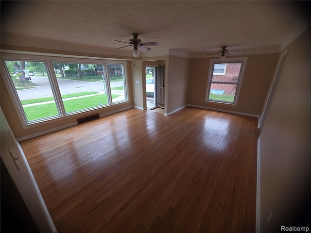 9990 Hambleton St, Canton, MI 48150 - empty room with ceiling fan and wood finished floors
