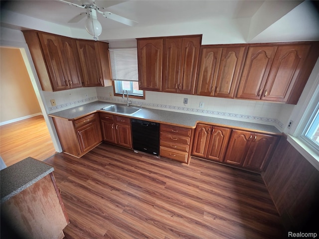 9990 Hambleton St, Canton, MI 48150 - kitchen with dishwasher, dark wood-style flooring, ceiling fan, backsplash, and brown cabinets