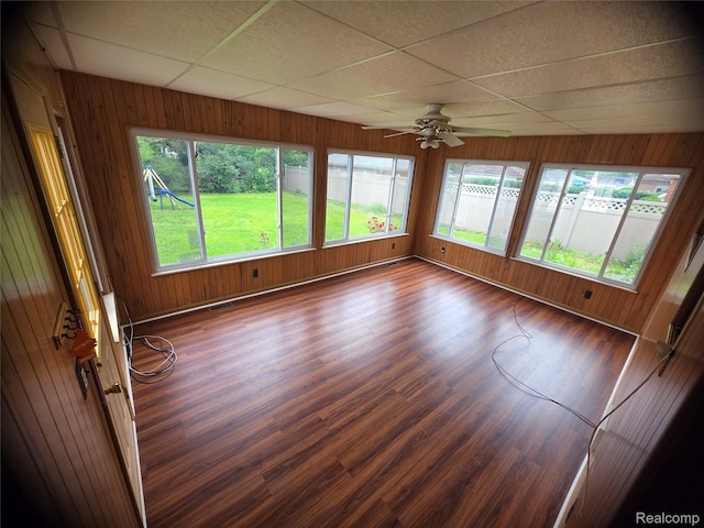 9990 Hambleton St, Canton, MI 48150 - unfurnished sunroom featuring wood finished floors, a drop ceiling, and wood walls