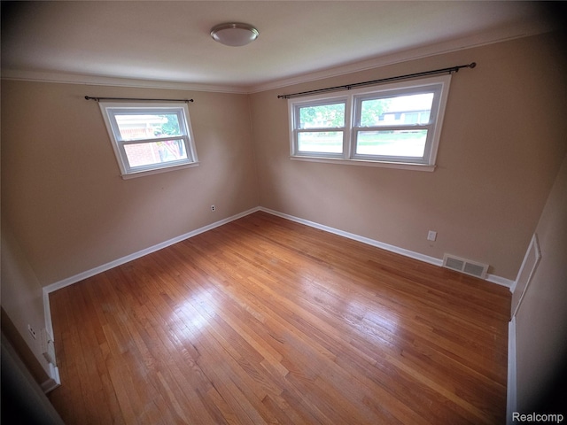 9990 Hambleton St, Canton, MI 48150 - empty room with ornamental molding and light wood finished floors