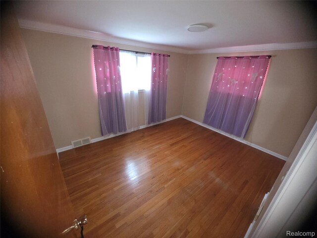 9990 Hambleton St, Canton, MI 48150 - unfurnished room featuring wood finished floors and ornamental molding