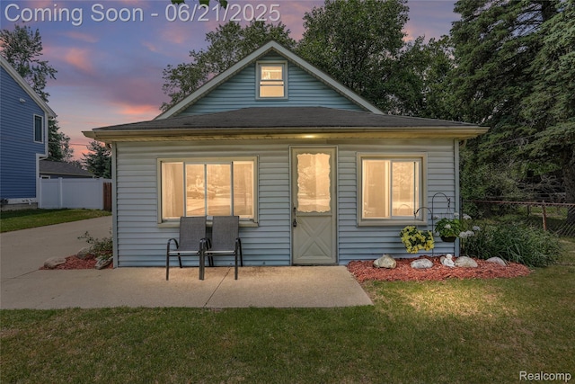 10997 Stark Rd, Livonia, MI 48150 - back of property at dusk featuring a patio area
