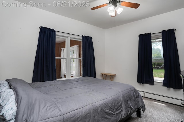 10997 Stark Rd, Livonia, MI 48150 - carpeted bedroom featuring baseboard heating and a ceiling fan
