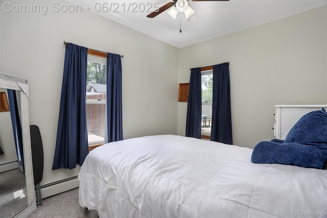 10997 Stark Rd, Livonia, MI 48150 - carpeted bedroom featuring a baseboard heating unit, ceiling fan, and baseboard heating