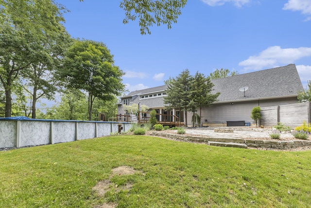 3778 22nd St, Dorr, MI 49323 - view of grassy yard with a wooden deck and a covered pool