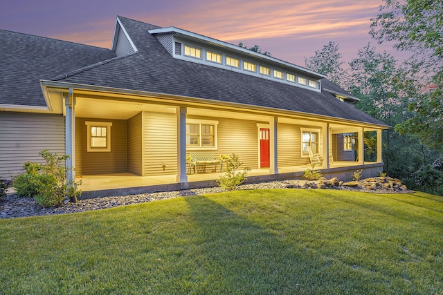 3778 22nd St, Dorr, MI 49323 - view of front facade with roof with shingles, covered porch, and a front yard