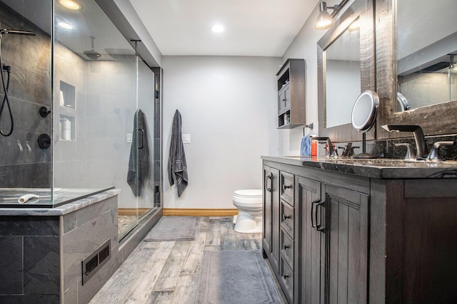 598 Dayburg Rd, Coldwater, MI 49036 - full bathroom featuring wood finished floors, vanity, a shower stall, and recessed lighting