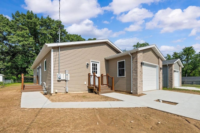 310 Hillview St, Buchanan, MI 49107 - view of front of home with concrete driveway and a garage