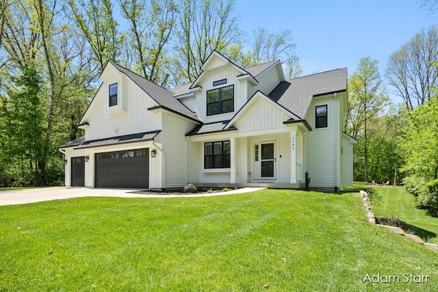 3980 Hathaway Rd, Kalamazoo, MI 49009 - modern farmhouse style home with board and batten siding, a garage, driveway, roof with shingles, and a front yard