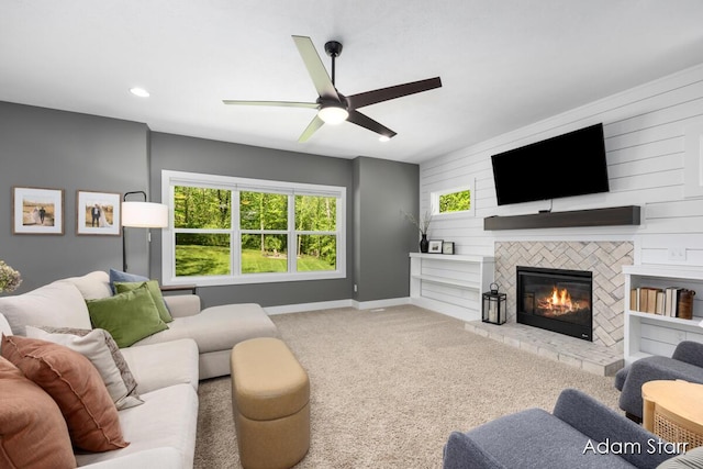 3980 Hathaway Rd, Kalamazoo, MI 49009 - living area featuring a ceiling fan, carpet floors, a tiled fireplace, and recessed lighting