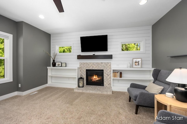 3980 Hathaway Rd, Kalamazoo, MI 49009 - living room with ceiling fan, carpet floors, a glass covered fireplace, and recessed lighting