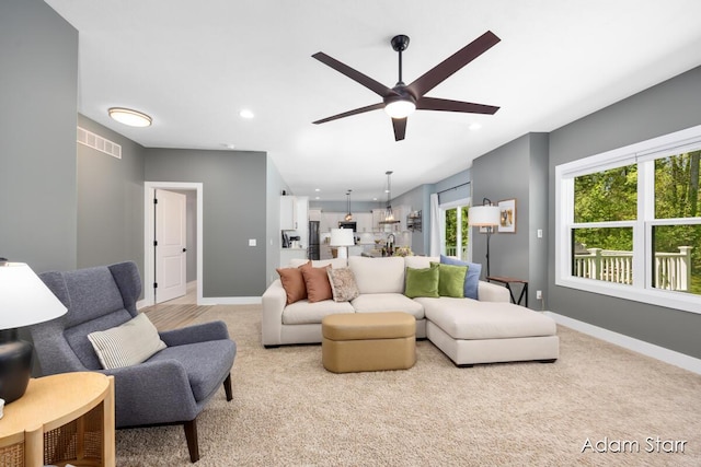 3980 Hathaway Rd, Kalamazoo, MI 49009 - living area with a ceiling fan, light colored carpet, and recessed lighting