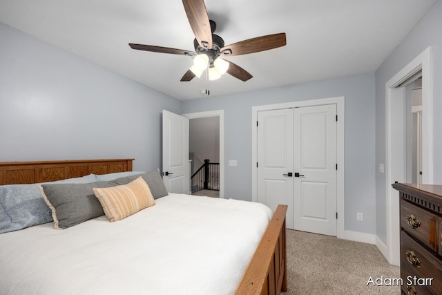 3980 Hathaway Rd, Kalamazoo, MI 49009 - bedroom featuring light carpet, a closet, and a ceiling fan