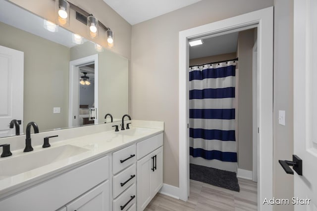 3980 Hathaway Rd, Kalamazoo, MI 49009 - full bath with double vanity and a ceiling fan