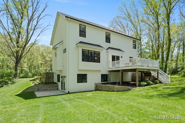 3980 Hathaway Rd, Kalamazoo, MI 49009 - back of house featuring stairway, a wooden deck, and a lawn