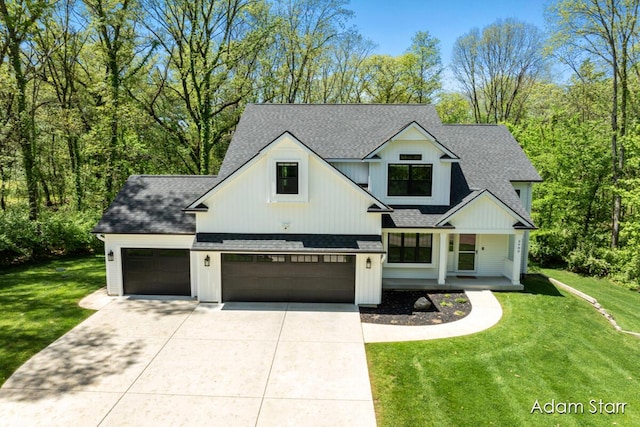 3980 Hathaway Rd, Kalamazoo, MI 49009 - modern inspired farmhouse with a shingled roof, a front yard, concrete driveway, an attached garage, and a porch