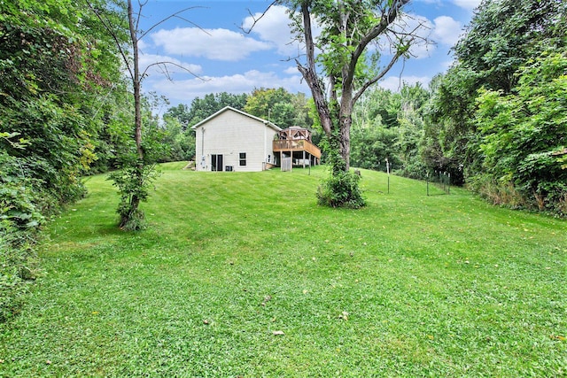 5293 Bartonville Rd, Belding, MI 48809 - view of grassy yard with a wooden deck