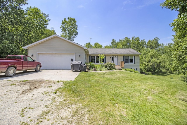 5293 Bartonville Rd, Belding, MI 48809 - ranch-style home featuring an attached garage, a front yard, and concrete driveway