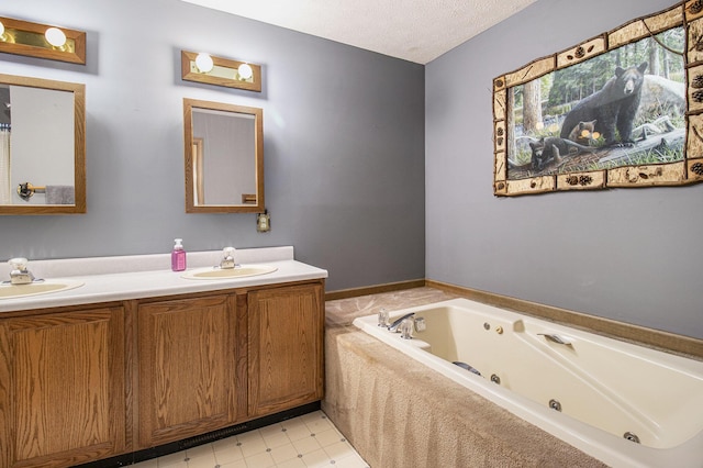5293 Bartonville Rd, Belding, MI 48809 - bathroom featuring double vanity, a jetted tub, and a textured ceiling