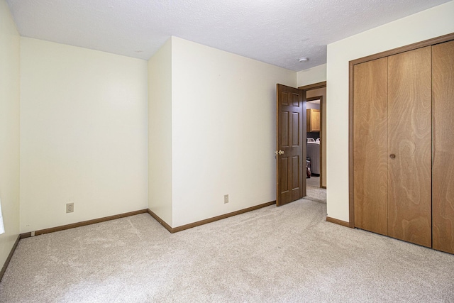 5293 Bartonville Rd, Belding, MI 48809 - unfurnished bedroom with light colored carpet and a closet
