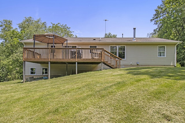 5293 Bartonville Rd, Belding, MI 48809 - back of property with a deck and a lawn