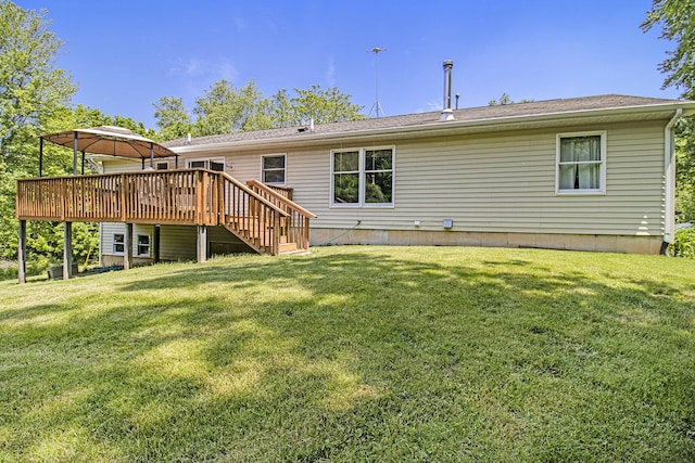 5293 Bartonville Rd, Belding, MI 48809 - back of house with a deck, a yard, and stairs