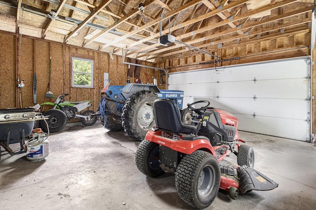 5293 Bartonville Rd, Belding, MI 48809 - garage featuring a garage door opener