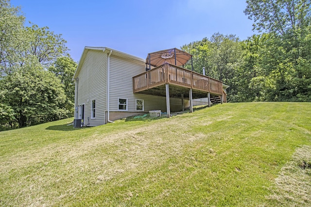 5293 Bartonville Rd, Belding, MI 48809 - back of property with a deck and a lawn