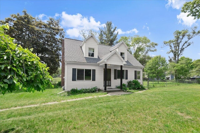 524 Kiddville St, Belding, MI 48809 - new england style home featuring roof with shingles