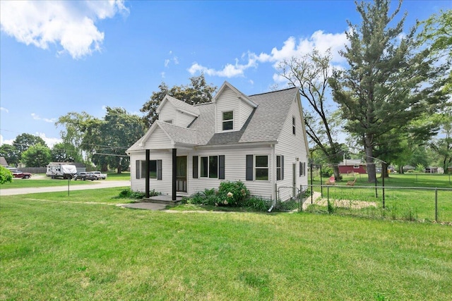 524 Kiddville St, Belding, MI 48809 - cape cod house featuring roof with shingles