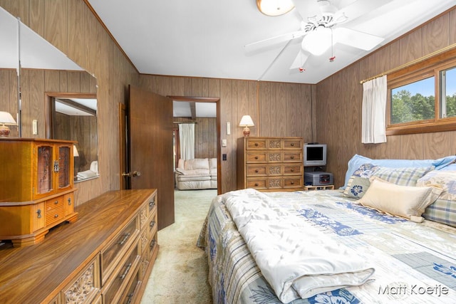 4410 Delaware Rd, Fremont, MI 49412 - carpeted bedroom featuring wood walls and a ceiling fan