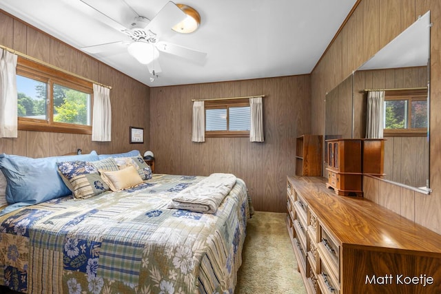 4410 Delaware Rd, Fremont, MI 49412 - bedroom featuring light colored carpet, wooden walls, and ceiling fan