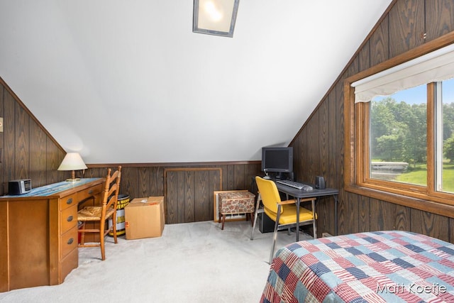 4410 Delaware Rd, Fremont, MI 49412 - carpeted bedroom featuring wood walls, a desk, and lofted ceiling