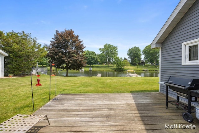 4410 Delaware Rd, Fremont, MI 49412 - wooden deck featuring a yard and a water view