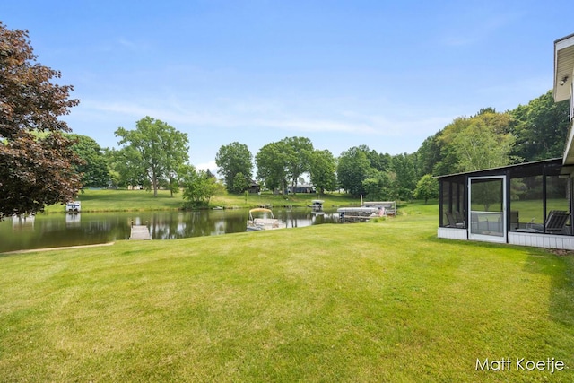 4410 Delaware Rd, Fremont, MI 49412 - view of grassy yard with a water view and a sunroom
