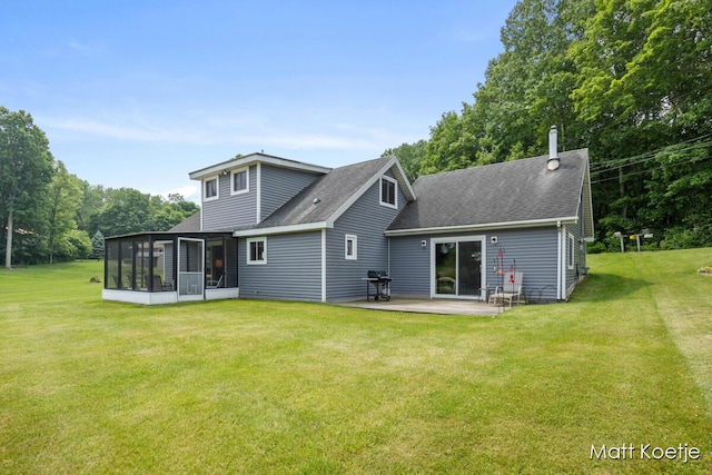 4410 Delaware Rd, Fremont, MI 49412 - back of property featuring a sunroom, a lawn, a shingled roof, and a patio