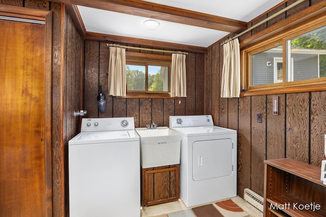 4410 Delaware Rd, Fremont, MI 49412 - laundry room featuring separate washer and dryer, baseboard heating, and wood walls