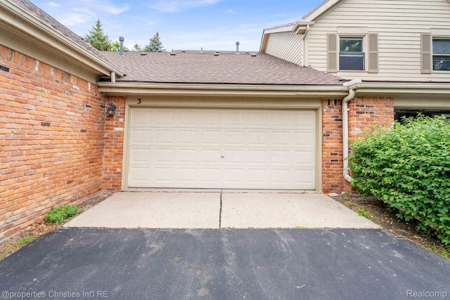 3 Cornell Ct Unit 27, Dearborn, MI 48124 - garage featuring asphalt driveway