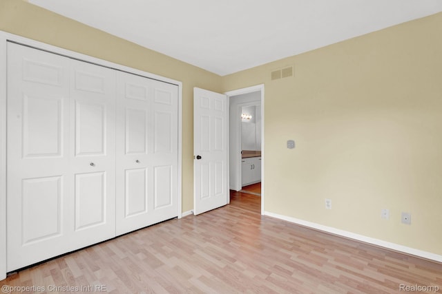3 Cornell Ct Unit 27, Dearborn, MI 48124 - unfurnished bedroom with light wood finished floors and a closet