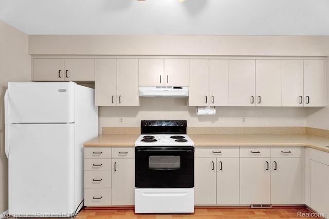 3 Cornell Ct Unit 27, Dearborn, MI 48124 - kitchen with freestanding refrigerator, electric range oven, under cabinet range hood, and light countertops