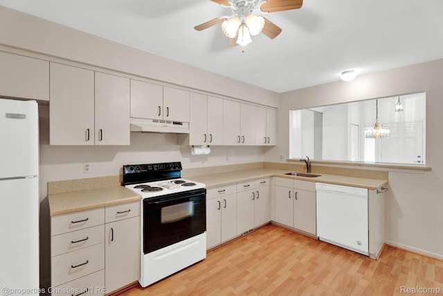 3 Cornell Ct Unit 27, Dearborn, MI 48124 - kitchen featuring white appliances, under cabinet range hood, light countertops, light wood-style floors, and ceiling fan