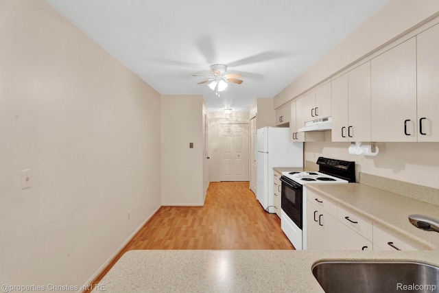 3 Cornell Ct Unit 27, Dearborn, MI 48124 - kitchen featuring range with electric stovetop, under cabinet range hood, a ceiling fan, light countertops, and light wood-style floors