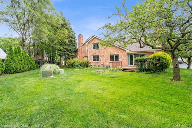 3 Cornell Ct Unit 27, Dearborn, MI 48124 - view of grassy yard with a deck