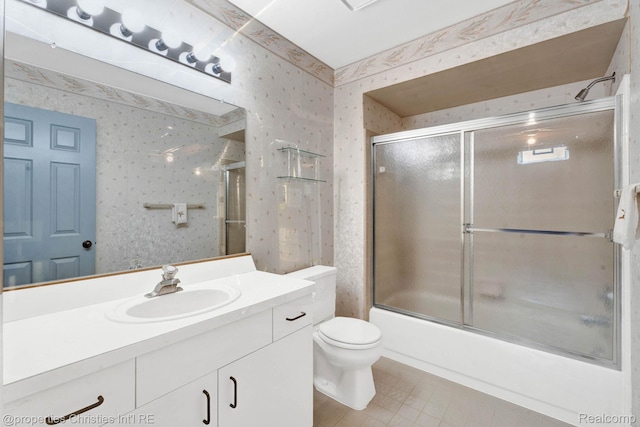 3 Cornell Ct Unit 27, Dearborn, MI 48124 - bathroom with wallpapered walls, vanity, shower / bath combination with glass door, and tile patterned flooring