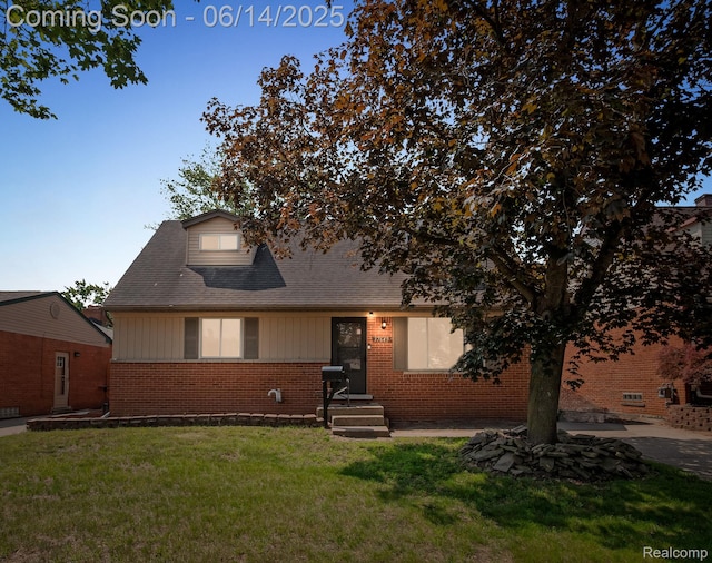 37649 Castle Dr, Romulus, MI 48174 - view of front of property featuring brick siding and a front lawn