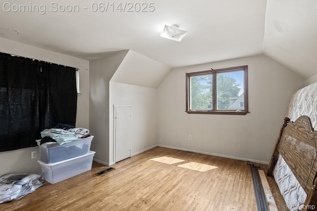 37649 Castle Dr, Romulus, MI 48174 - additional living space featuring vaulted ceiling and light wood-style floors