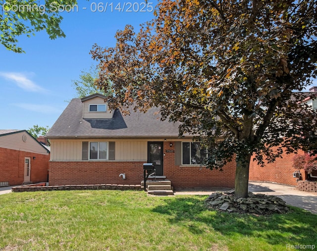 37649 Castle Dr, Romulus, MI 48174 - bungalow-style home with a front yard and brick siding
