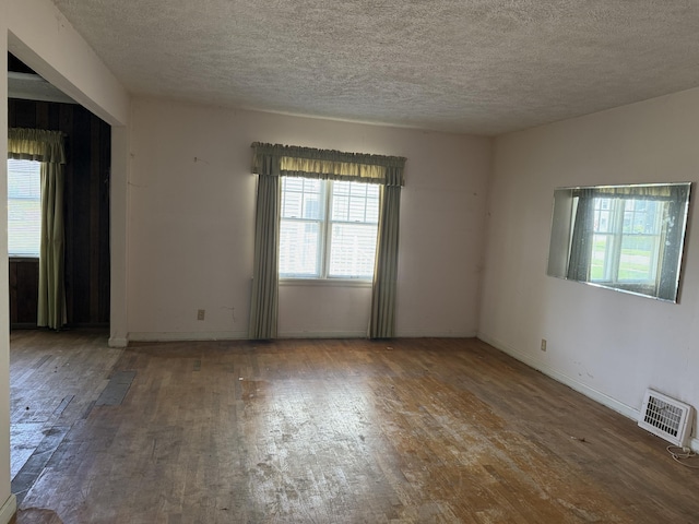 911 Napier Ave, Saint Joseph, MI 49085 - unfurnished room with hardwood / wood-style floors and a textured ceiling