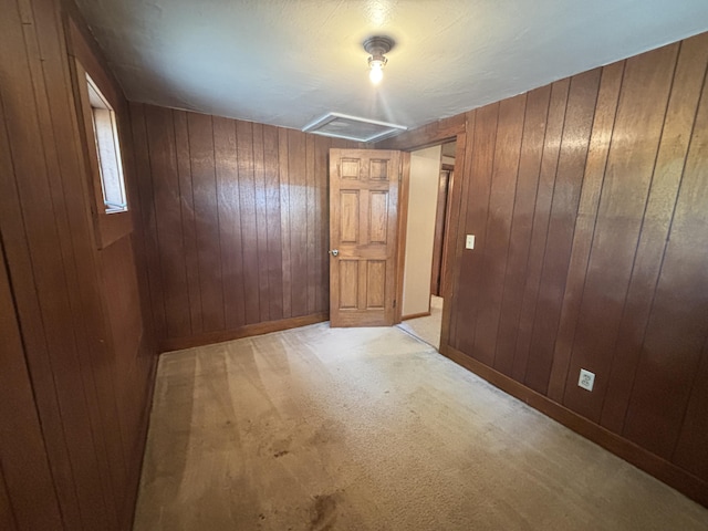2523 E Wildcat, Saint Johns, MI 48879 - spare room featuring wood walls and light colored carpet