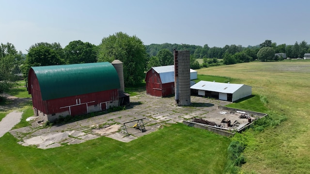 2523 E Wildcat, Saint Johns, MI 48879 - view of green lawn with a barn and an outbuilding